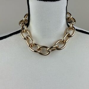 Chunky gold tone necklace choker. statement